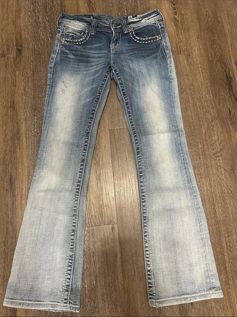 Light Wash Women’s Bootcut Jeans with sparkle cross detail on back - Blue